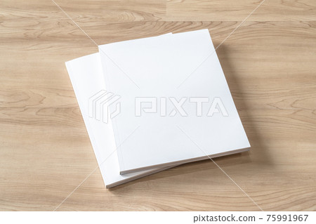 Book cover mockup with blank white front paper page a4 paperback mock up for catalog, magazine, menu, booklet, notebook, portfolio design template on wood table background 75991967