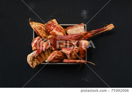 Variety of air dried and smoked lamb and beef meat in wooden box Variety of air dried and smoked lamb and beef meat in wooden box 75992006