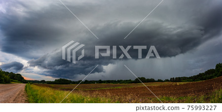 Supercell storm clouds with wall cloud and intense rain Supercell storm clouds with wall cloud and intense rain 75993227