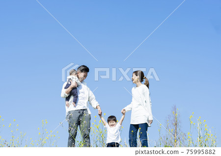 A family walking happily A family walking happily 75995882