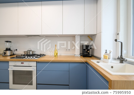 Modern blue-teal colored furniture kitchen interior 75995950