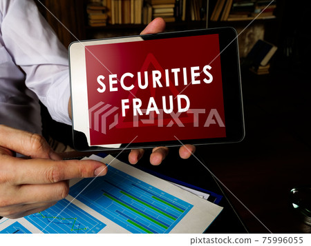 Manager shows Securities fraud alert on the tablet. Manager shows Securities fraud alert on the tablet. 75996055