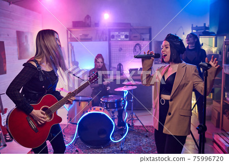 Music band performing in the club 75996720