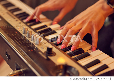 Man playing piano Man playing piano 75996881