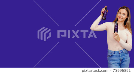 Attractive young caucasian woman presenting cosmetic products bottles Attractive young caucasian woman presenting cosmetic products bottles 75996891