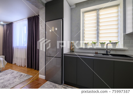 Modern dark grey small kitchen interior Modern dark grey small kitchen interior 75997387