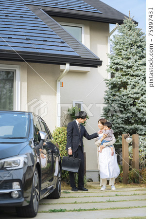 Wife and baby seeing off husband going to work 75997431