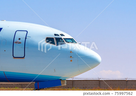 Cockpit of big passenger airliner on runway close up 75997562