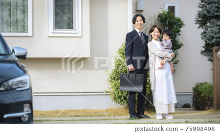 Wife and baby seeing off husband going to work 75998498