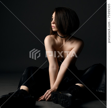 Young sexy sensual brunette woman in leather pants Young sexy sensual brunette woman in leather pants 75999305