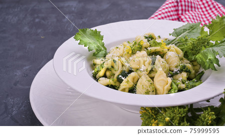 orecchiette alla pugliese, homemade Italian pasta. Orecchiette with turnip tops. Traditional food of orecchiette alla pugliese, homemade Italian pasta. Orecchiette with turnip tops. Traditional food of 75999595