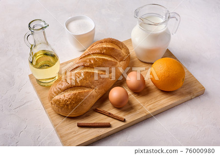 Ingredients for cooking homemade traditional Spanish torrijas or French toasts Ingredients for cooking homemade traditional Spanish torrijas or French toasts 76000980
