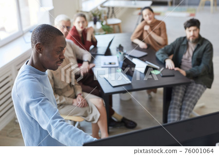 African-American Man Presenting in IT Meeting African-American Man Presenting in IT Meeting 76001064