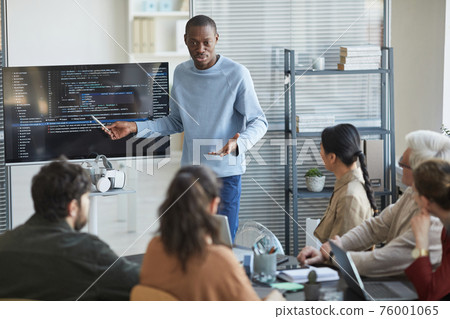 African Man Presenting in IT Meeting African Man Presenting in IT Meeting 76001065