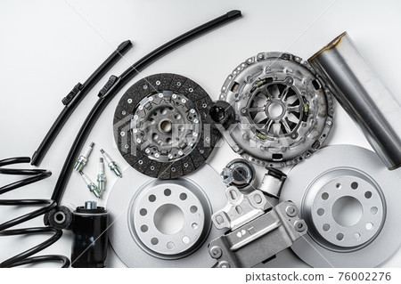 New metal auto parts on grey background New metal auto parts on grey background 76002276