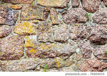 Rough stone wall as creative background texture 76004033