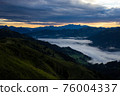 Early morning in the mountains. The sun rises over the mountains. Dawn in the mountains. 76004337