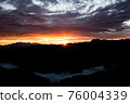 Early morning in the mountains. The sun rises over the mountains. Dawn in the mountains. 76004339