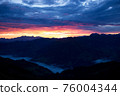Early morning in the mountains. The sun rises over the mountains. Dawn in the mountains. 76004344