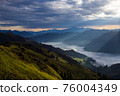 Early morning in the mountains. The sun rises over the mountains. Dawn in the mountains. 76004349