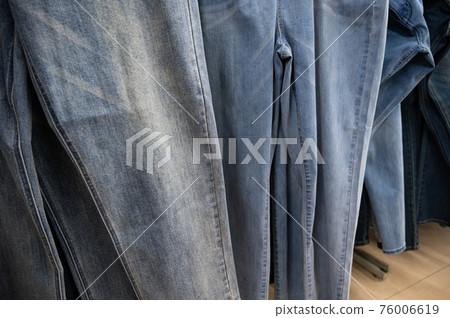 Jeans hanging on a store hanger Jeans hanging on a store hanger 76006619