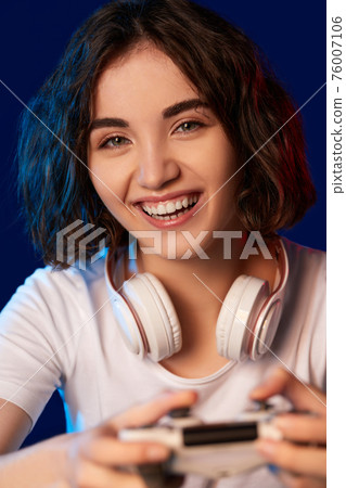 happy curly involved gamer girl playing video games happy curly involved gamer girl playing video games 76007106