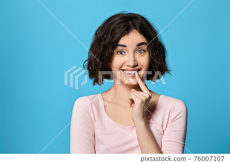 impressed woman with unexpected reaction gesturing impressed woman with unexpected reaction gesturing 76007107