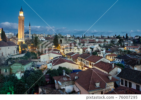 View of tiled roofs of old city in Antalya in blue hour in spring. View of tiled roofs of old city in Antalya in blue hour in spring. 76007295