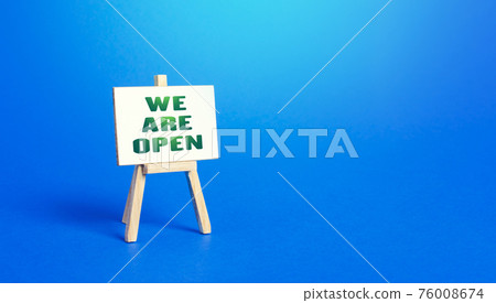We Are Open easel sign. Exit from severe quarantine conditions, economic and business recovery. Return to normal life. Adaptation to rules. Business flexibility and readiness for new challenges. 76008674
