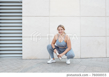 Fit woman after training Fit woman after training 76008933