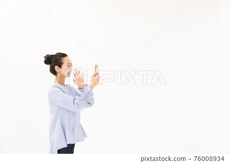 Woman making a video call Woman making a video call 76008934