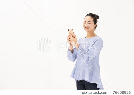 Woman making a video call Woman making a video call 76008936