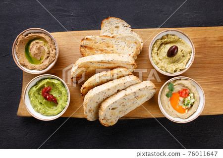 Vegan chef pate variety, humus and crunchy toasts Vegan chef pate variety, humus and crunchy toasts 76011647