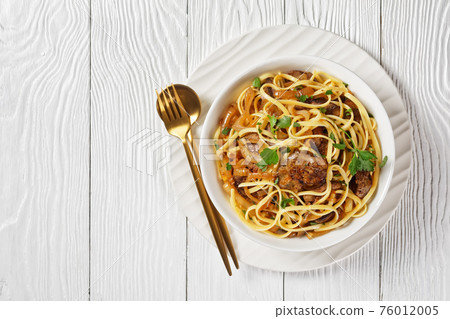 pasta linguine with fried chicken liver, top view pasta linguine with fried chicken liver, top view 76012005