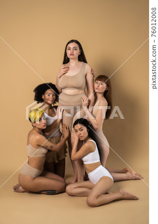 Five diverse woman with different skin and body types posing with confidence Five diverse woman with different skin and body types posing with confidence 76012008