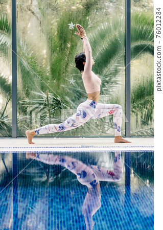 sportive woman yoga practice morning relaxation on vacation resort 76012284