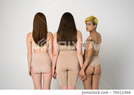 Back view of the three different girls posing at the studio Back view of the three different girls posing at the studio 76012466