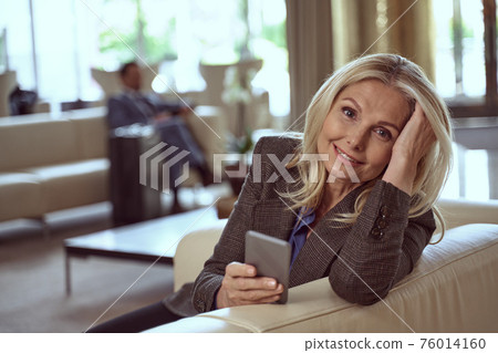 Pretty lady having trouble checking in the hotel online Pretty lady having trouble checking in the hotel online 76014160