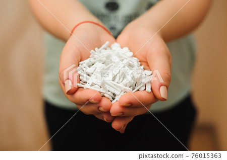 A lot of lancets in the hands. Medicine, diabetes, glycemia, health care and people concept. 76015363