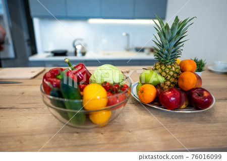 Fruits And Vegetables On The Table Of Modern Kitchen Fruits And Vegetables On The Table Of Modern Kitchen 76016099