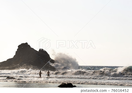 People on the sandy beach of Benijo on the island of Tenerife.Spain People on the sandy beach of Benijo on the island of Tenerife.Spain 76016452