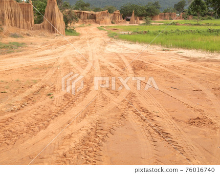 Tire tracks on the soil 76016740