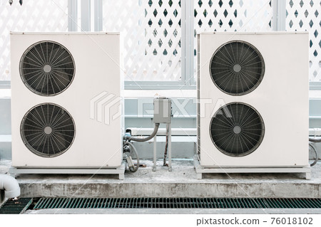 Cooling Air Condition Unit and Control System, Air Condenser Engine Station Outside Building of HVAC Systems. Electrical Compressor Fan Coil of Air Conditioning Equipment for Home Residential Units. Cooling Air Condition Unit and Control System, Air Condenser Engine Station Outside Building of HVAC Systems. Electrical Compressor Fan Coil of Air Conditioning Equipment for Home Residential Units. 76018102