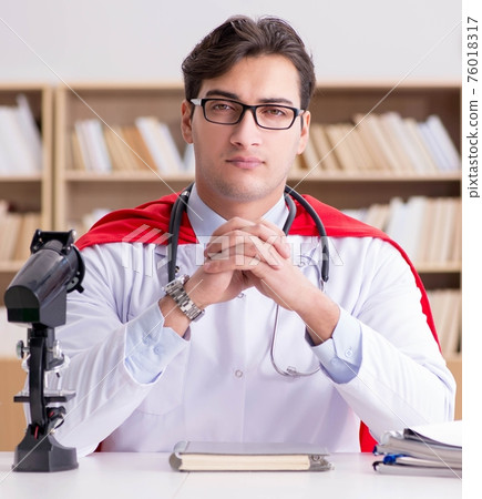 Superhero doctor working in the lab hospital Superhero doctor working in the lab hospital 76018317