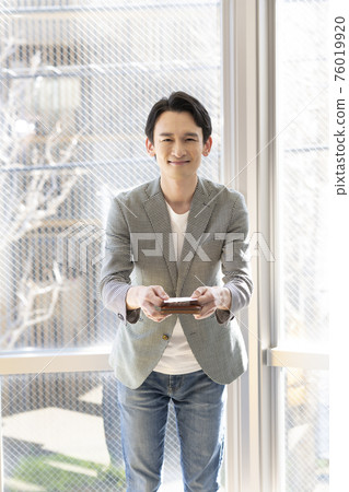 Man presenting a business card (front) Man presenting a business card (front) 76019920