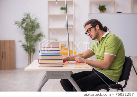 Young sick male teacher student in blood transfusion concept Young sick male teacher student in blood transfusion concept 76021297
