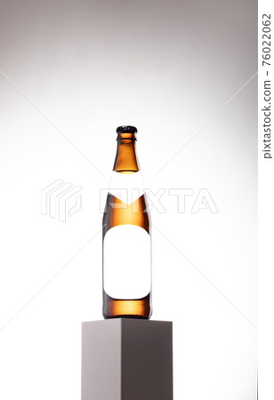 Brown Beer Bottle Mock-Up - Blank Label on podium Brown Beer Bottle Mock-Up - Blank Label on podium 76022062