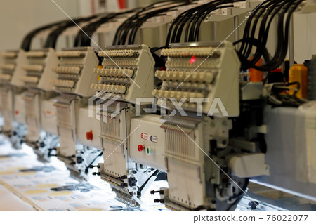 modern multi head embroidery machine close up modern multi head embroidery machine close up 76022077
