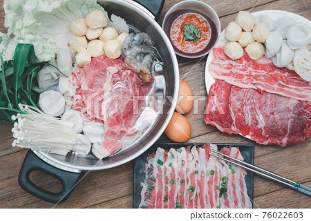 Cooking food in hot pot for make sukiyaki or shabu 76022603