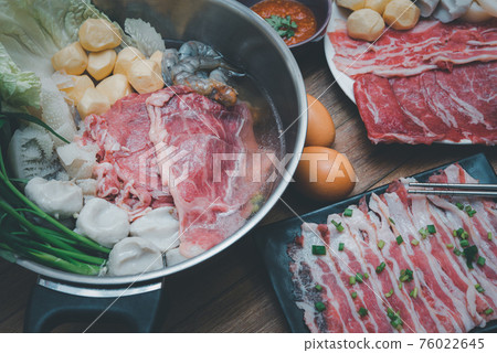 Cooking food in hot pot for make sukiyaki or shabu 76022645